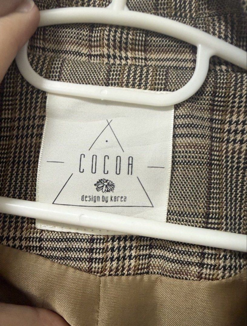 COCOA Brown Plaid Oversized Blazer (Category: Coats, Jackets and Outerwear) located in Quezon City. Submitted by lovedbymaxandmikoy (Listing ID 1470135141, Image 2). Description: - Brand: COCOA (Designed in Korea) - Style: Classic brown plaid/tartan blazer with structured lapels - Closure: Double-button front with matching dark buttons - Pockets: Two front hip flap pockets - Lining: Fully lined in silky bronze fabric - Fit & Use: Great versatile 