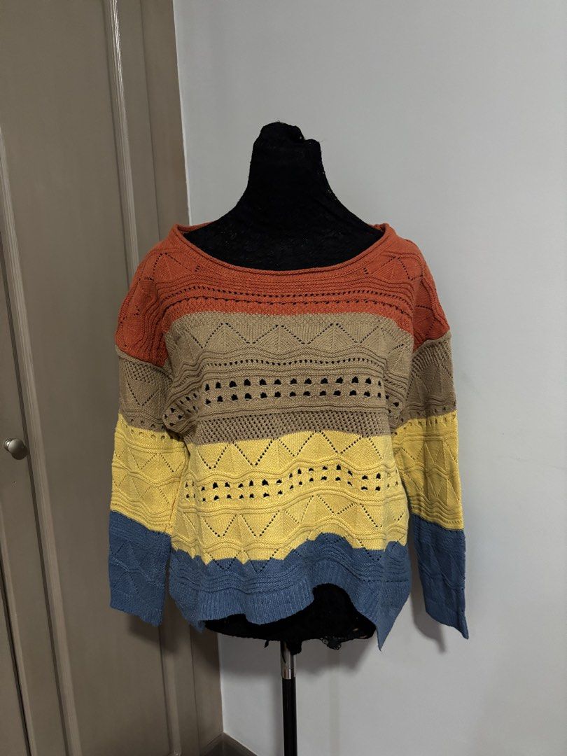 Colorblock Knit Sweater Multicolor Striped Pullover (Category: Longsleeves) located in Quezon City. Submitted by ada_412 (Listing ID 1470128496, Image 1). Description: - Style: Multi-colored knit sweater with a relaxed fit - Pattern: Striped with open-knit geometric and chevron details - Colors: Rust orange, taupe, yellow, and denim blue - Design: Wide neckline and long sleeves - Material: Soft and comfortable knit fabric.