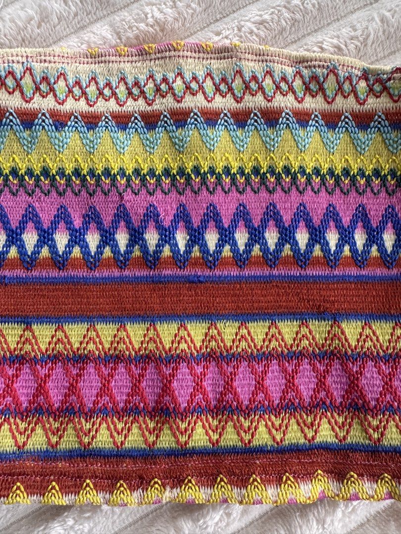 Colorful Knit Boho Pattern Tube Top Strapless Crop Top (Category: Sleeveless) located in Manila. Submitted by bellebeauty.2002 (Listing ID 1470008769, Image 3). Description: Vibrant multi-colored knitted tube top with geometric patterns in pink, yellow, blue, and red. Features a fitted strapless design with optional thin white straps. Perfect for warm weather or layering.