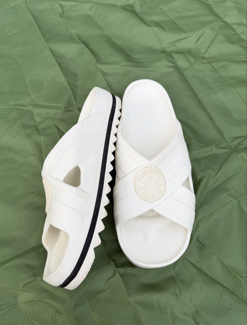 Converse All Star Cross Strap Platform Slides White (Category: Flats & Sandals) located in Cavite. Submitted by maxs.bl (Listing ID 1469955730, Image 2). Description: - Brand: Converse All Star - Style: Platform slides with criss-cross straps - Color: White with signature black stripe detail - Features: Iconic circular patch, thick textured platform sole, and ridged bottom grip - Fit: Easy slip-on style, super comfortable for daily wear - Conditi