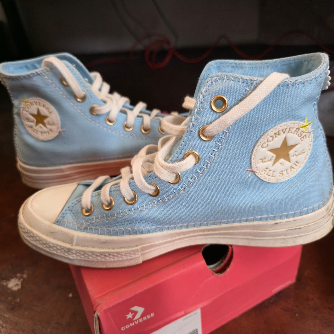 Converse Chuck 70 HI Crafted Stitching Light Blue (Category: Sneakers) located in Dumaguete. Submitted by terrificraft (Listing ID 1469963395, Image 3). Description: - Brand: Converse Chuck Taylor All Star 70 High Top - Model: A09838C - Occasion: lifestyle - Fit: Unisex - Series: Chuck 70 - Color: Light blue canvas with gold eyelets and white laces - Special Feature: Charming embroidered details on sides with white flower on heels - Condition: Li