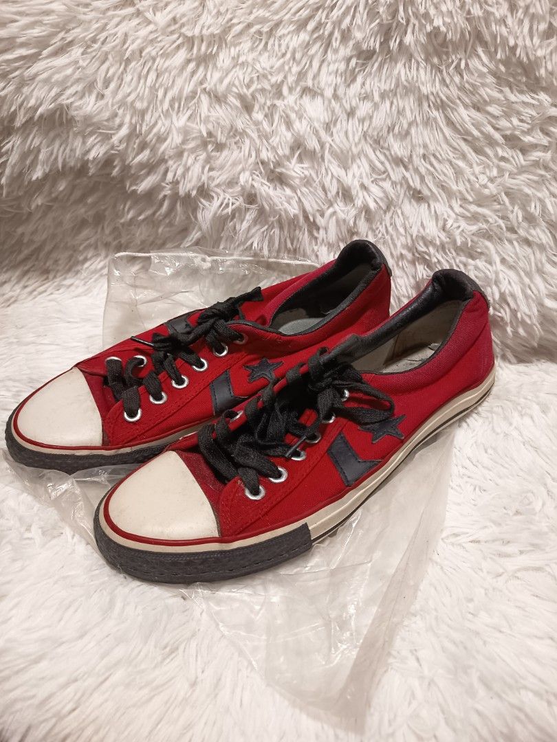 Converse Star Player Low Top Red Sneakers (Category: Sneakers) located in Manila. Submitted by riojariza55755 (Listing ID 1470141387, Image 1). Description: - Brand: Converse size 9 1/2 - Style: Low-top canvas sneakers, classic skate style - Colorway: Red canvas with black laces, white toe caps, and dark rubber soles - Details: Navy chevron star side logos and dark leather trim around the collar - Condition: Normal signs of wear on midsoles and u