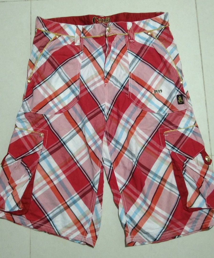 Coogi Red Plaid Cargo Shorts Size W38 (Category: Shorts) located in Manila. Submitted by aj.bermundo (Listing ID 1470025837, Image 2). Description: - Brand: Coogi - Style: Classic streetwear cargo shorts - Pattern & Color: Red plaid - Size: 38 waist - Material: 100% cotton for comfort - Features: Multiple side pockets with button closures and embroidered Coogi logo on the back pocket - Condition: Excellent.
