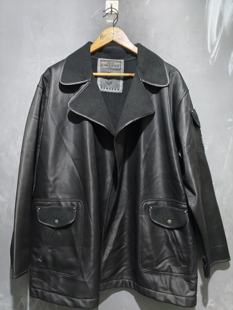 Cop Copine Paris Black Coat Jacket Size 1 (Category: Coats, Jackets and Outerwear) located in Taguig. Submitted by daily_hustle (Listing ID 1469980004, Image 1). Description: - Brand: Cop Copine Paris - Size: Tagged Size 1 - Material: PVC, polyester, and polyurethane with cozy fleece lining - Design: Unique Parisian aesthetic with contrast textured collar - Pockets: Buttoned front pockets and sleeve pocket with branded patch detail - Closure: Ful