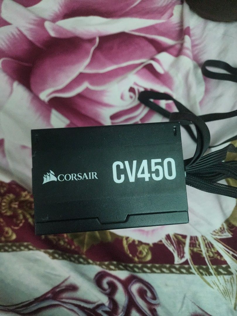 Corsair CV450 Power Supply Unit (Category: Computer Parts) located in Taguig. Submitted by moseslopez97175 (Listing ID 1470128752, Image 2). Description: - Brand: Corsair Model: CV450 - Power Output: 450 Watts - Form Factor: Standard ATX - Color: Black casing with attached black cables (includes PCIe and CPU connectors) - Condition: Clean unit, pulled from a working desktop setup, legible specification sticker RFS: Upgraded my PSU .