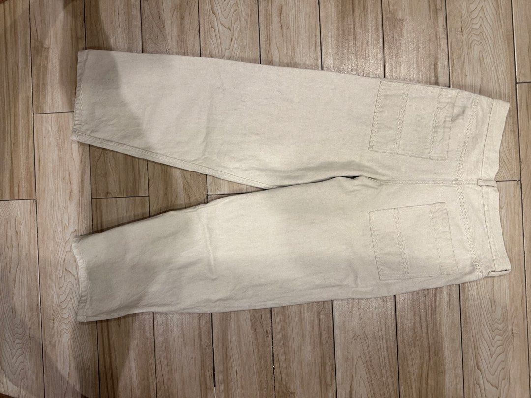 COS Relaxed Wide Leg White Jeans (Category: Jeans) located in Santa Rosa. Submitted by jericobngo (Listing ID 1469950776, Image 3). Description: - Brand: COS - Style: Relaxed wide-leg pants, mid-rise, full length - Color: Off-white / Light beige - Size: 46 (as labeled on waistband), fits waist 30-32 - Details: Sturdy denim-like twill fabric, two back patch pockets, interior QR code care tag .