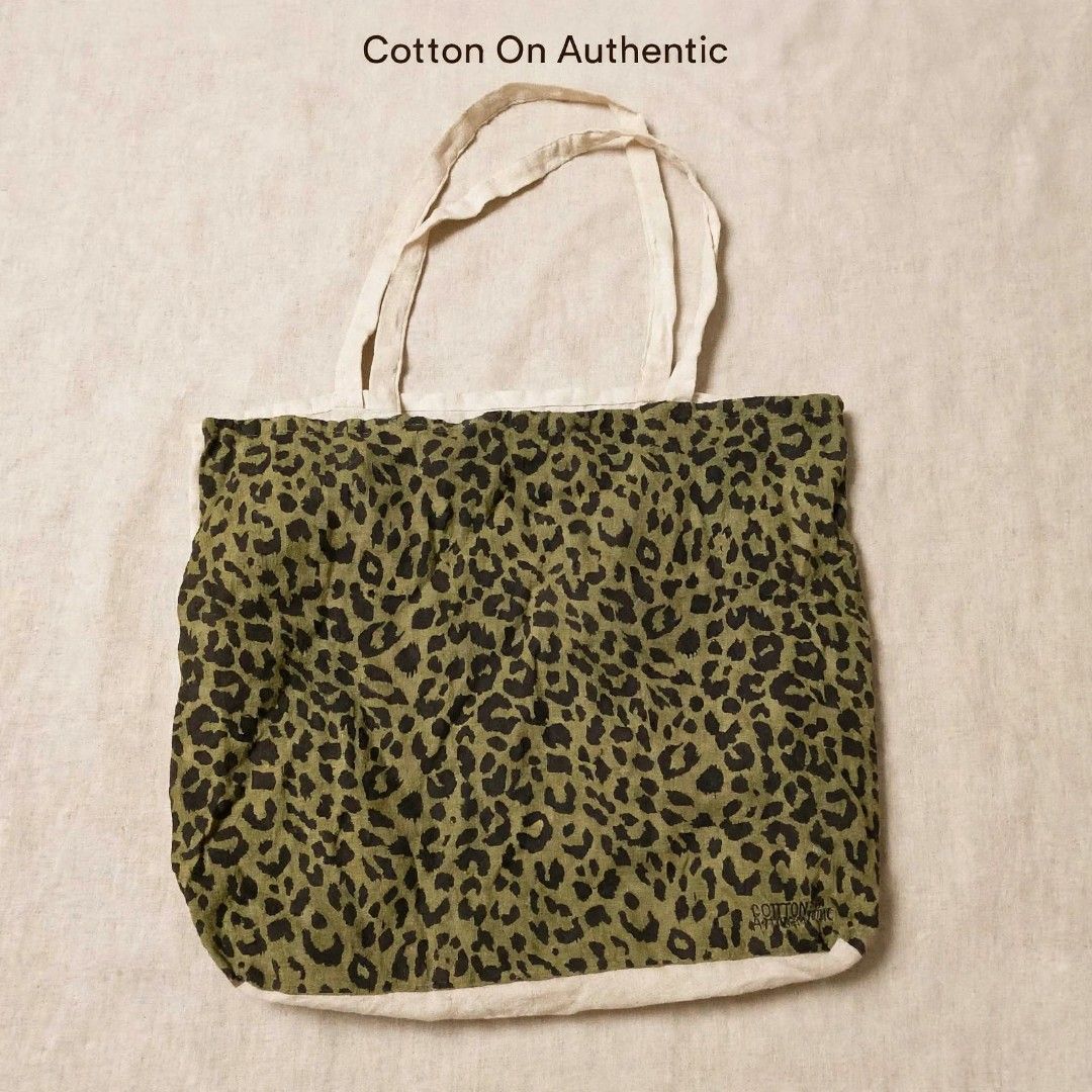 Cotton On Leopard Print Canvas Tote Bag - Authentic Preloved (Category: Tote Bags) located in Cainta. Submitted by yugenken (Listing ID 1468725298, Image 1). Description: Selling my Cotton On Leopard Tote Bag 🐆 ✔️ Authentic Cotton On - from Australia ✔️ Tag: www.cottonon.com / #954447 SEP/2019 ✔️ Material: Canvas / Cotton - durable and lightweight ✔️ Color: Olive Green Leopard + Beige trim ✔️ Spacious - perfect for school, work, beach, grocery M