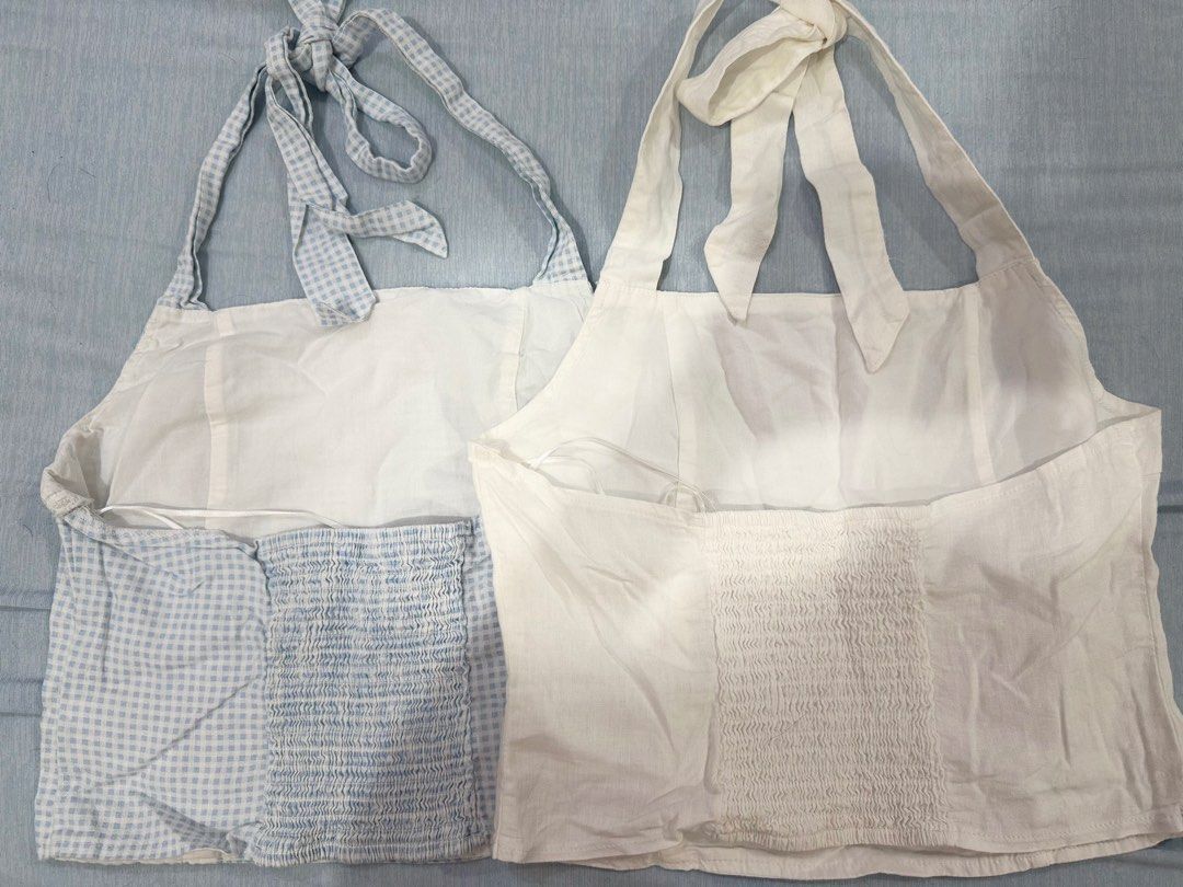 Cotton On Tie-Shoulder Halter Tops Set (2 pcs) (Category: Sleeveless) located in Manila. Submitted by buymiclothes.47 (Listing ID 1470107438, Image 3). Description: Cotton On Tie-Shoulder Halter Tops Bundle (2 pcs) | Size AU 10 Selling these two cute Cotton On tops as a set! 🩵🤍 Includes: * 1 Blue & white gingham/checkered top * 1 Plain white/cream top Details: * Brand: Cotton On * Both size AU 10 / US 6 / EU 38 * Adjustable tie straps with bow 
