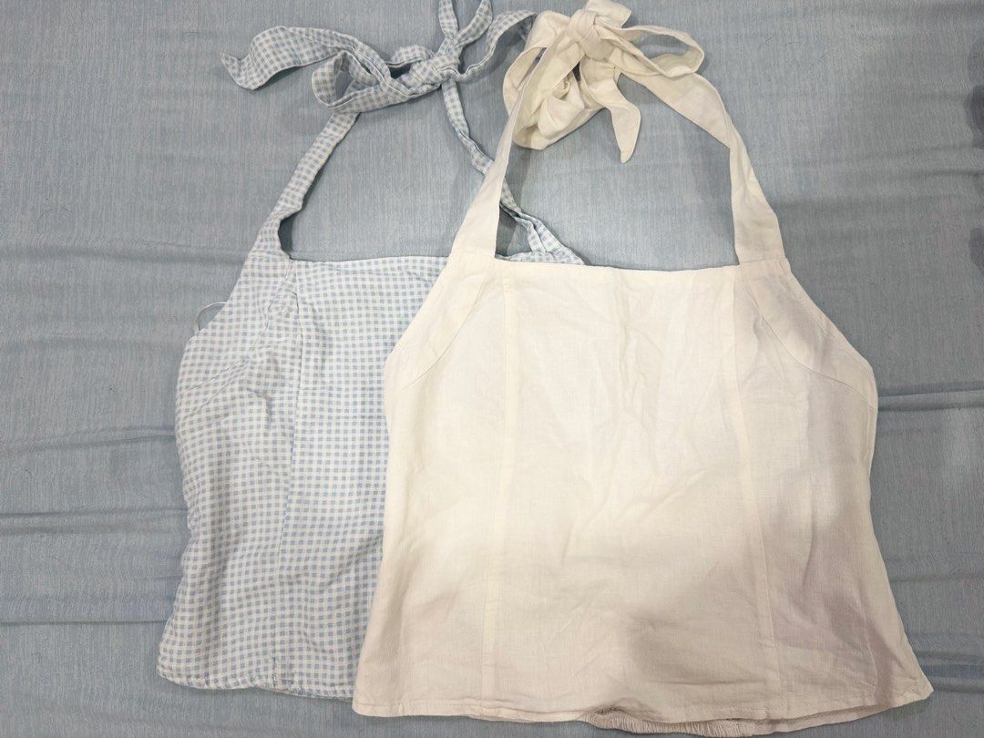 Cotton On Tie-Shoulder Halter Tops Set (2 pcs) (Category: Sleeveless) located in Manila. Submitted by buymiclothes.47 (Listing ID 1470107438, Image 1). Description: Cotton On Tie-Shoulder Halter Tops Bundle (2 pcs) | Size AU 10 Selling these two cute Cotton On tops as a set! 🩵🤍 Includes: * 1 Blue & white gingham/checkered top * 1 Plain white/cream top Details: * Brand: Cotton On * Both size AU 10 / US 6 / EU 38 * Adjustable tie straps with bow 