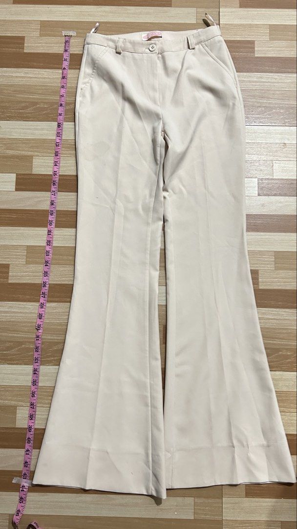 Cream Beige Flared Pants size M (26-29) (Category: Jeans) located in Manila. Submitted by mshnlj_ (Listing ID 1469967943, Image 2). Description: - Color: Cream Beige - Style: Flared legs with front creases for a polished, structured look - Details: Waistband with belt loops, secure button closure, and functional front side pockets - Length: Full length, approx. 43 inches down the side - Versatility: Clean, chic design that easily transitions from