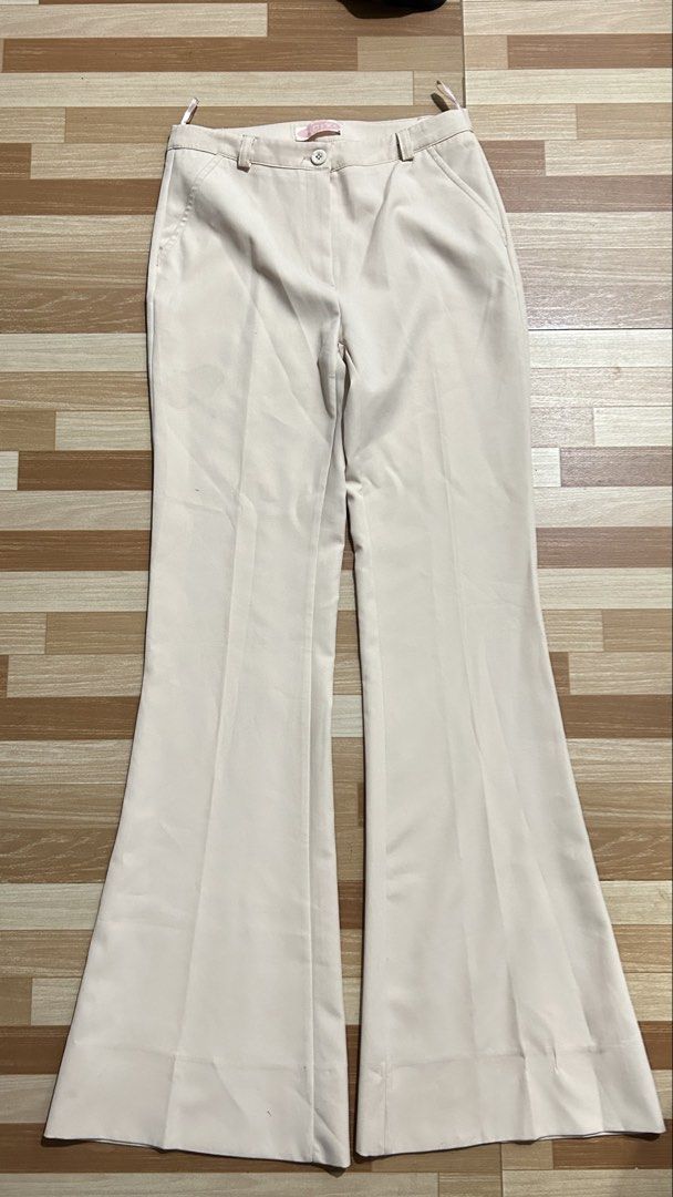 Cream Beige Flared Pants size M (26-29) (Category: Jeans) located in Manila. Submitted by mshnlj_ (Listing ID 1469967943, Image 1). Description: - Color: Cream Beige - Style: Flared legs with front creases for a polished, structured look - Details: Waistband with belt loops, secure button closure, and functional front side pockets - Length: Full length, approx. 43 inches down the side - Versatility: Clean, chic design that easily transitions from