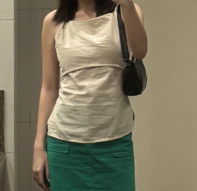 Cream Cami Tank Top Spaghetti Strap (Category: Sleeveless) located in Manila. Submitted by chicbyj (Listing ID 1469980481, Image 1). Description: - Color: Cream - Style: Cami tank top with spaghetti straps - Material: Soft, lightweight fabric - Fit: Comfortable and easy to wear - Versatility: Perfect for layering or solo wear in warm weather; matches easily with skirts, jeans, or shorts.