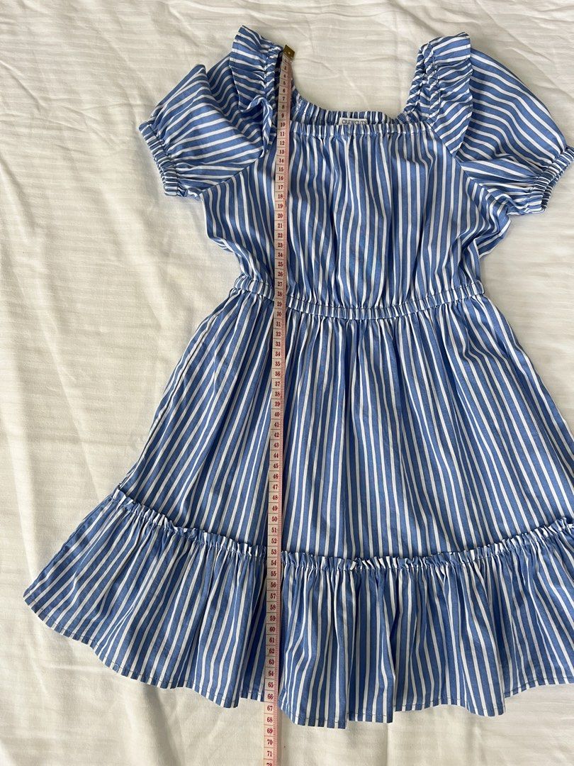 Crewcuts Blue White Striped Ruffle Dress (Category: Babies & Kids Fashion) located in San Fernando. Submitted by wearvfs (Listing ID 1470003601, Image 3). Description: - Brand: Crewcuts - Size: 6 - Design: Blue and white stripes with square neckline, ruffle sleeve trim, and tiered skirt - Material: cotton blend - Comfort: Elastic waist for easy, everyday wear - Measurements: Length ~68 cm, Waist width ~32 cm (stretches in the waist).