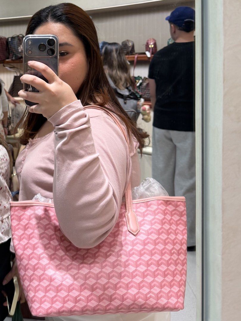 Cristy Ng Russo Medium Tote Bag (Category: Luxury Bags & Wallets) located in Malabon City. Submitted by gorain (Listing ID 1470085043, Image 1). Description: - Brand: Cristy Ng Tote Bag - Color: Pink with signature chevron pattern - Condition: Like new, completely clean interior and exterior - Features: Classic shoulder straps, very roomy, includes original packaging stuffing - Perfect as a chic and practical daily carryall rarely used.