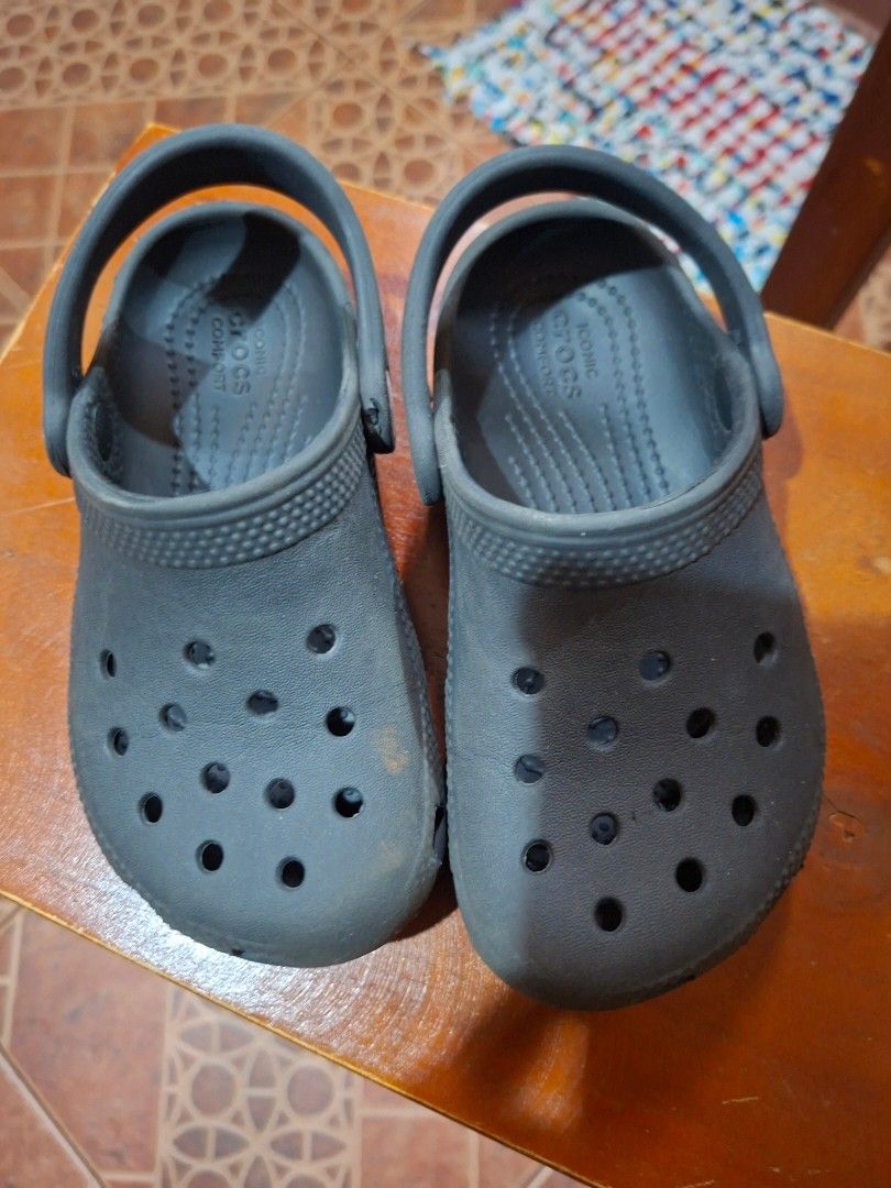 Crocs Classic Clog Charcoal Grey (Category: Babies & Kids Fashion) located in Paranaque City. Submitted by musttryshop_08 (Listing ID 1469991281, Image 1). Description: - Color: Charcoal Grey - Size: C10 (molded on bottom) - Features: Iconic comfort footbed, slip-on design, and pivoting heel straps - Condition: Soles show normal wear from use - Perfect for active kids and easy everyday wear.