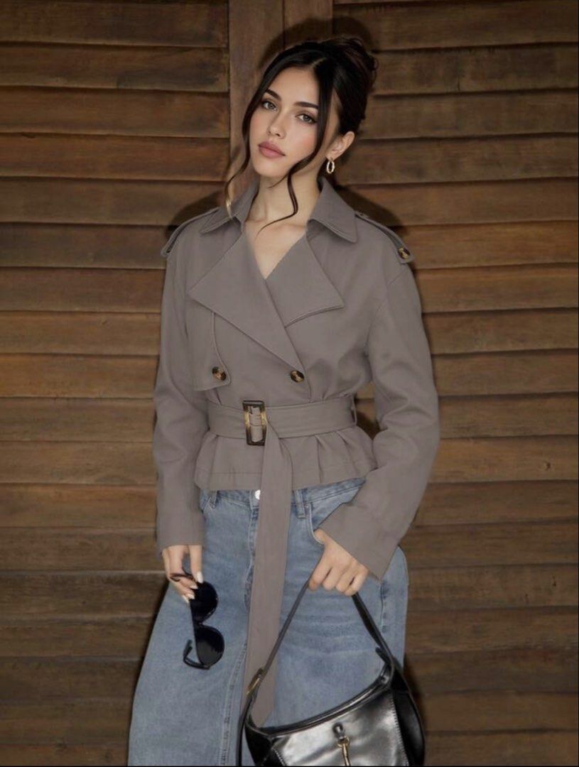 Cropped Double-Breasted Trench Jacket with Belt (Category: Coats, Jackets and Outerwear) located in Manila. Submitted by nlgll (Listing ID 1470045674, Image 2). Description: - Style: Cropped double-breasted trench jacket - Color: Neutral taupe - Details: Tortoiseshell buttons, matching waist belt, classic lapel collar, and shoulder epaulets - Silhouette: Structured with a trendy flared hem - Fit & Pairing: Great layering piece that pairs effortle