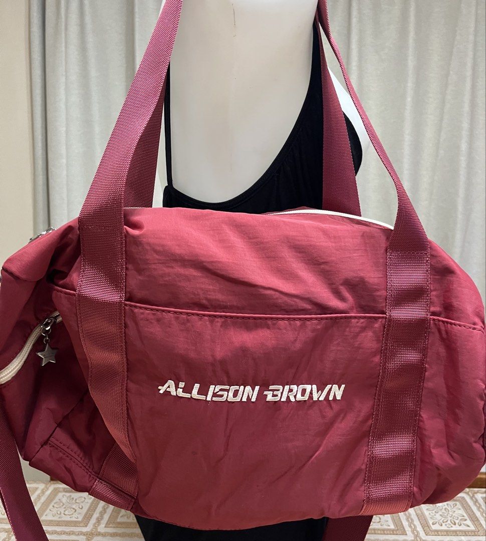 Crossbody bag (Category: Cross-body Bags) located in Bacoor. Submitted by ayit. (Listing ID 1470067986, Image 1). Description: Orig japan glinf sf inc s nego - Brand/Model: Allison Brown Crossbody/Duffel Bag - Color: Maroon with white zipper and white embroidered branding - Material: Durable nylon/fabric material - Versatile carry options: Dual hand straps and an adjustable, removable long shoulder strap - Features: Spacious main compartment, fro