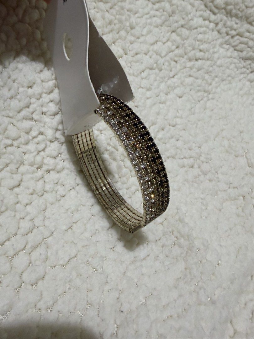 Crystal Rhinestone Cuff Bracelet (Category: Bracelets) located in Paranaque City. Submitted by greatfinds108 (Listing ID 1469971451, Image 2). Description: - Stunning rhinestone cuff bracelet with silver and dark crystals - Adjustable open design for a comfortable fit on most wrists - Brand new with original retail tag attached - Adds instant sparkle to both casual and dressy outfits For pick up only.