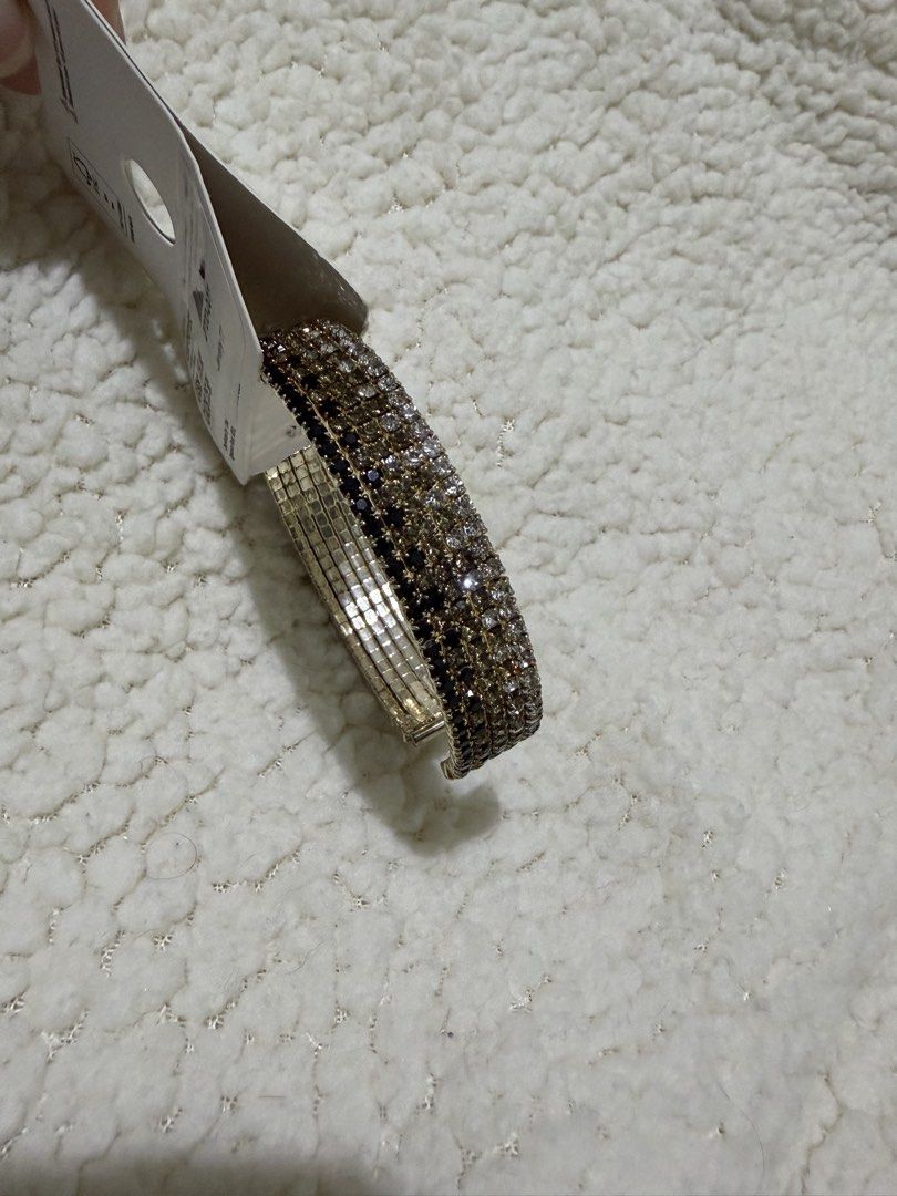 Crystal Rhinestone Cuff Bracelet (Category: Bracelets) located in Paranaque City. Submitted by greatfinds108 (Listing ID 1469971451, Image 1). Description: - Stunning rhinestone cuff bracelet with silver and dark crystals - Adjustable open design for a comfortable fit on most wrists - Brand new with original retail tag attached - Adds instant sparkle to both casual and dressy outfits For pick up only.