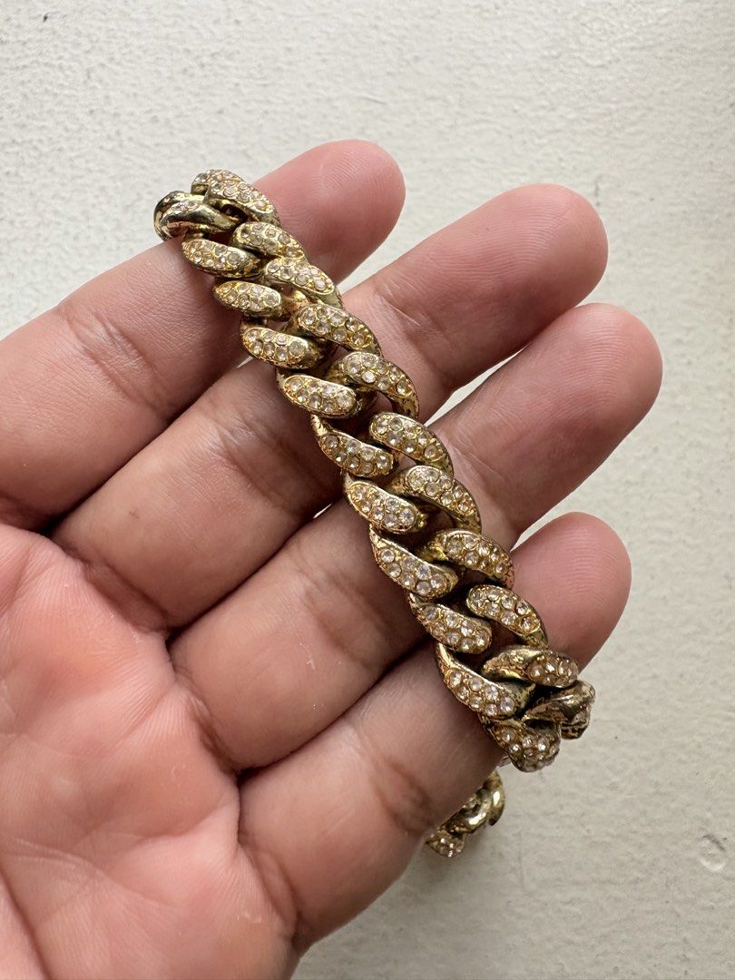 Cuban Iced-Out Chain Necklace (Category: Jewelry) located in Mandaluyong City. Submitted by material_boi (Listing ID 1469996426, Image 3). Description: Nice accessory if you love adornments. Bought this for ₱2K I think for a costume party. Gold then may stones siya, i don’t know what stones are these. Di masagwa ang pagka-gold nya. Double lock. Mabigat. 20 inches long when laid flat. Issues: tarnished na yung likod, pero yung harap na may stones 