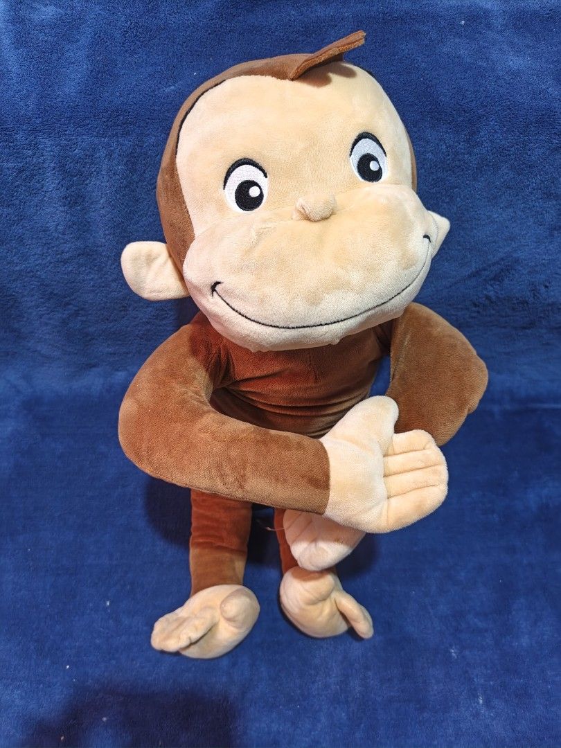 Curious George plush toy stuffed monkey (Category: Plushies & Soft Toys) located in Manila. Submitted by kirstentoyshub (Listing ID 1470011616, Image 1). Description: - Adorable brown stuffed monkey plush toy - Features a soft fabric body, big round eyes, and a friendly smile - Cream-colored face, ears, hands, and feet - Classic character design inspired by beloved books and shows - Clean and well-maintained condition, ready for its new home.