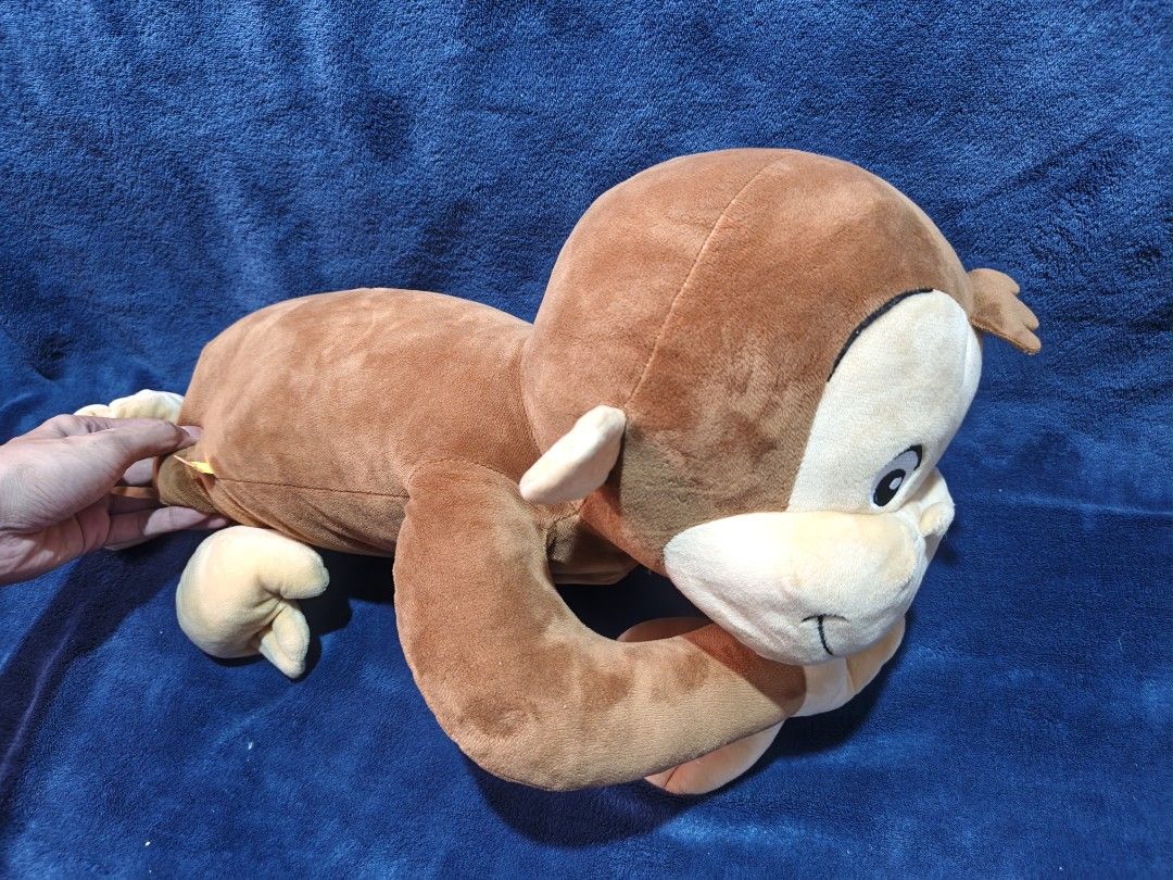 Curious George plush toy stuffed monkey (Category: Plushies & Soft Toys) located in Manila. Submitted by kirstentoyshub (Listing ID 1470011616, Image 3). Description: - Adorable brown stuffed monkey plush toy - Features a soft fabric body, big round eyes, and a friendly smile - Cream-colored face, ears, hands, and feet - Classic character design inspired by beloved books and shows - Clean and well-maintained condition, ready for its new home.