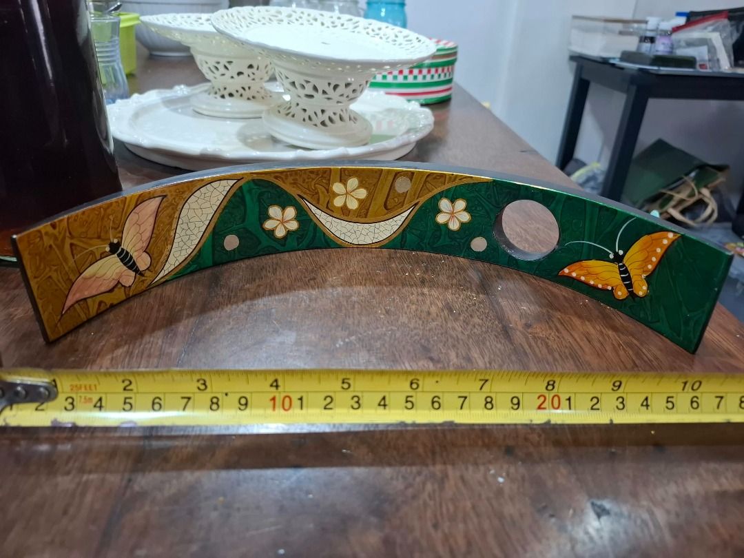 Curved Butterfly Decorative Holder (Category: Other Home Decor) located in Pasig City. Submitted by dripcounty (Listing ID 1470025120, Image 1). Description: Curved Butterfly Decorative Holder ₱150 Bought in the Philippines Condition: Good / preloved Curved decorative holder with green and gold butterfly design and two circular openings. Exact intended use unconfirmed. Sold as pictured. Actual item shown in photos. Delivery fee shouldered by buye