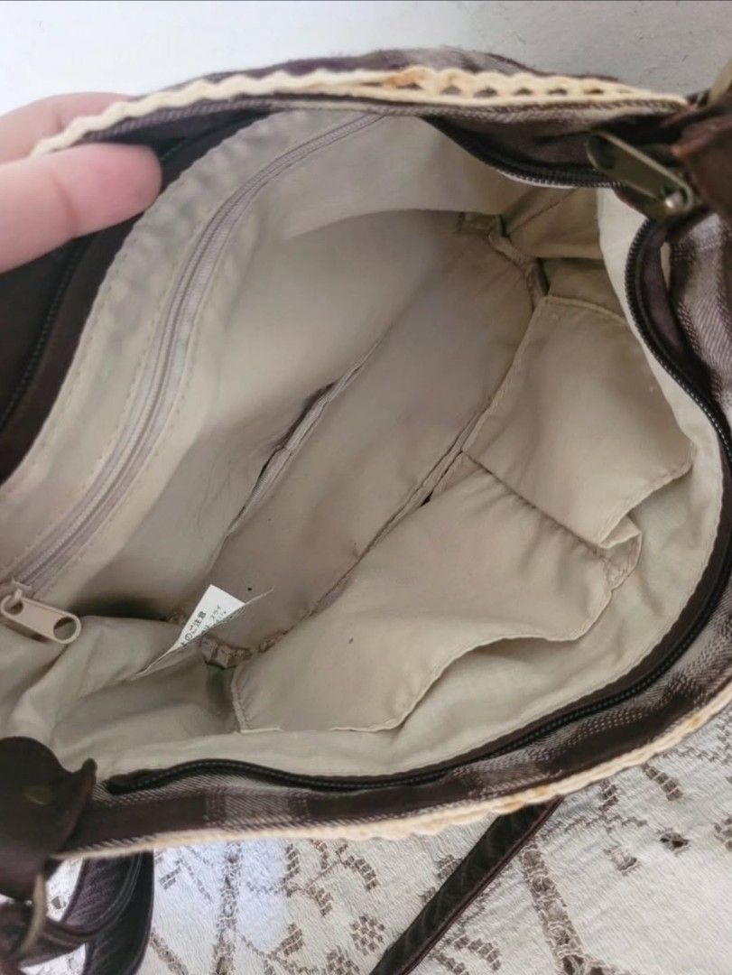 Cute Brown Bow Checked Sling Bag (Category: Cross-body Bags) located in Balanga. Submitted by marae_c (Listing ID 1470085410, Image 3). Description: In very good condition. Few brown stains and little rub sa may sling. See last pic for ref. Other than that all goods and quite spacoius for its size. Perfect bag for mori kei, academia and cottage vibes as well. To edit. Measurements..