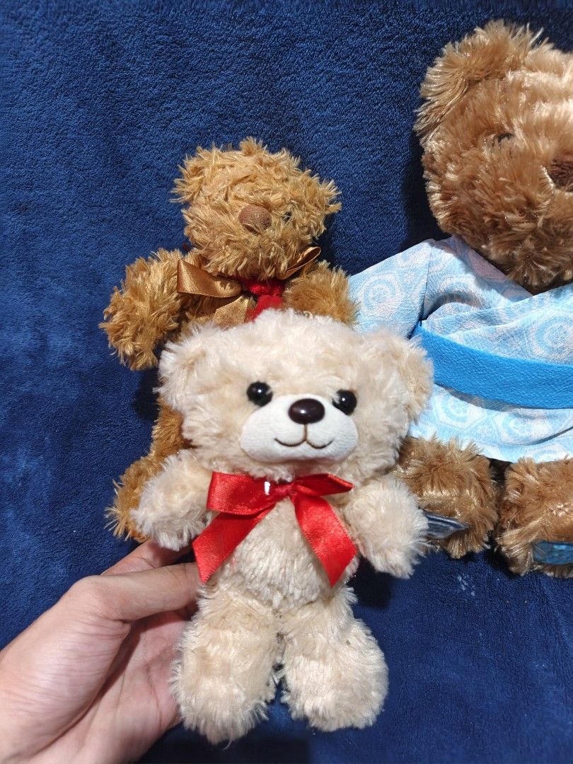 Cute Teddy Bear Plush Toy Bundle Set (Category: Plushies & Soft Toys) located in Manila. Submitted by kirstentoyshub (Listing ID 1470016334, Image 2). Description: - Set of 4 unique, soft-fur teddy bears - Features: Japanese blue yukata robe, '4 Apr' embroidered shirt with gems, red ribbon bow, and brown/red ribbon - Material: Ultra-soft plush fur - Perfect addition for stuffed toy collectors and gift-giving - Condition: Brand new / Excellent.