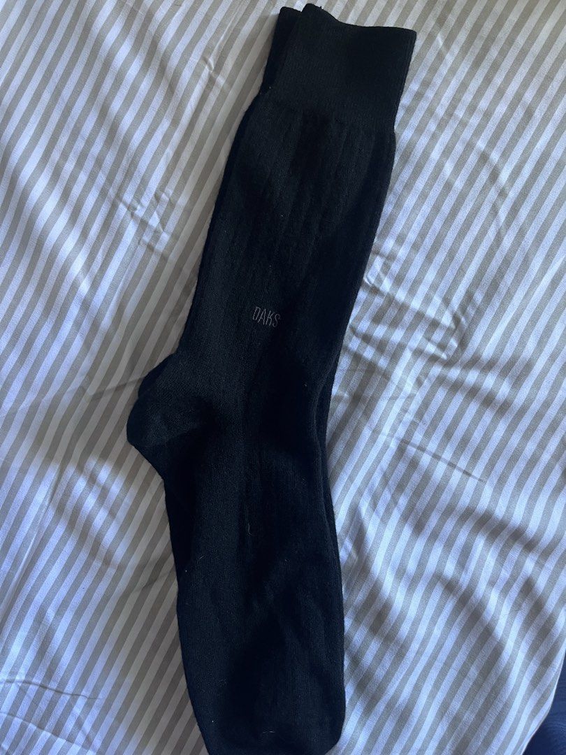 DAKS Black Socks (Category: Socks) located in Baguio. Submitted by gbwardrobe (Listing ID 1470058593, Image 1). Description: - Brand: DAKS - Color: Classic Black - Style: Crew length, ribbed upper texture - Detail: Embroidered logo on the side - Condition: Clean fabric, excellent wardrobe staple for daily wear.