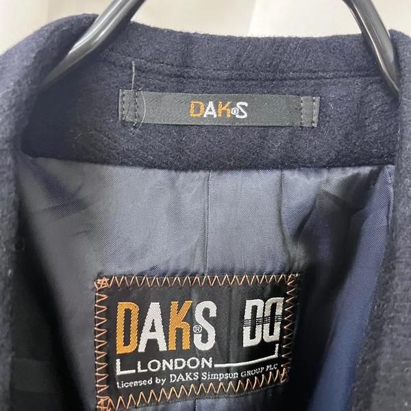 DAKS Coat (Category: Coats, Jackets and Outerwear) located in Singapore. Submitted by bunjangpartners (Listing ID 1470103498, Image 2). Description: DAKS Coat Size: Marked as M Condition: Clean with slight signs of use [Detailed Size] Shoulder + Arm: 75cm Total Length: 88cm Chest: 60cm Shipping fee 3,000 KRW (6,000 KRW for Jeju/Remote Mountainous Areas) --[Before You Buy]-- Sourced from Bunjang, Korea's leading recommerce platform through our pur