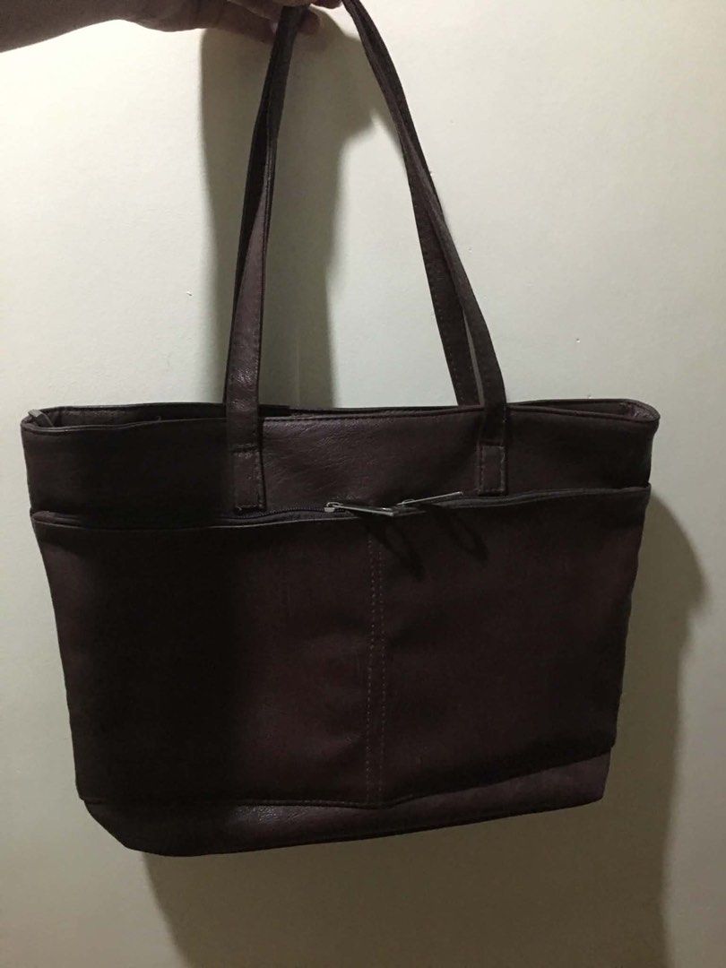 Dark Brown Chic Faux Leather Shoulder Bag (Category: Tote Bags) located in Cabuyao City. Submitted by 4everblooms (Listing ID 1470086277, Image 1). Description: - Compartments: Front and back exterior zippered pockets, plus a zippered interior center divider - Condition: Clean exterior and interior, well-maintained - Spacious, Kasya whole yellow pad/long bond paper .