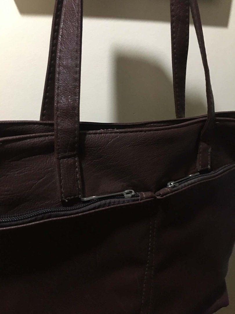 Dark Brown Chic Faux Leather Shoulder Bag (Category: Tote Bags) located in Cabuyao City. Submitted by 4everblooms (Listing ID 1470086277, Image 3). Description: - Compartments: Front and back exterior zippered pockets, plus a zippered interior center divider - Condition: Clean exterior and interior, well-maintained - Spacious, Kasya whole yellow pad/long bond paper .