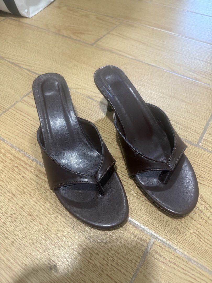 Dark Brown Thong Kitten Heel Mules Size 36 (Category: Heels) located in Manila. Submitted by iya.prlta (Listing ID 1469999603, Image 1). Description: - Color: Dark brown - Style: Thong-style kitten heels, slip-on with open pointed toe - Heel: Low heel for easy walking - Size: 36 (stamped on sole) - Condition: Worn once, minor light dirt on soles from outdoor wear.