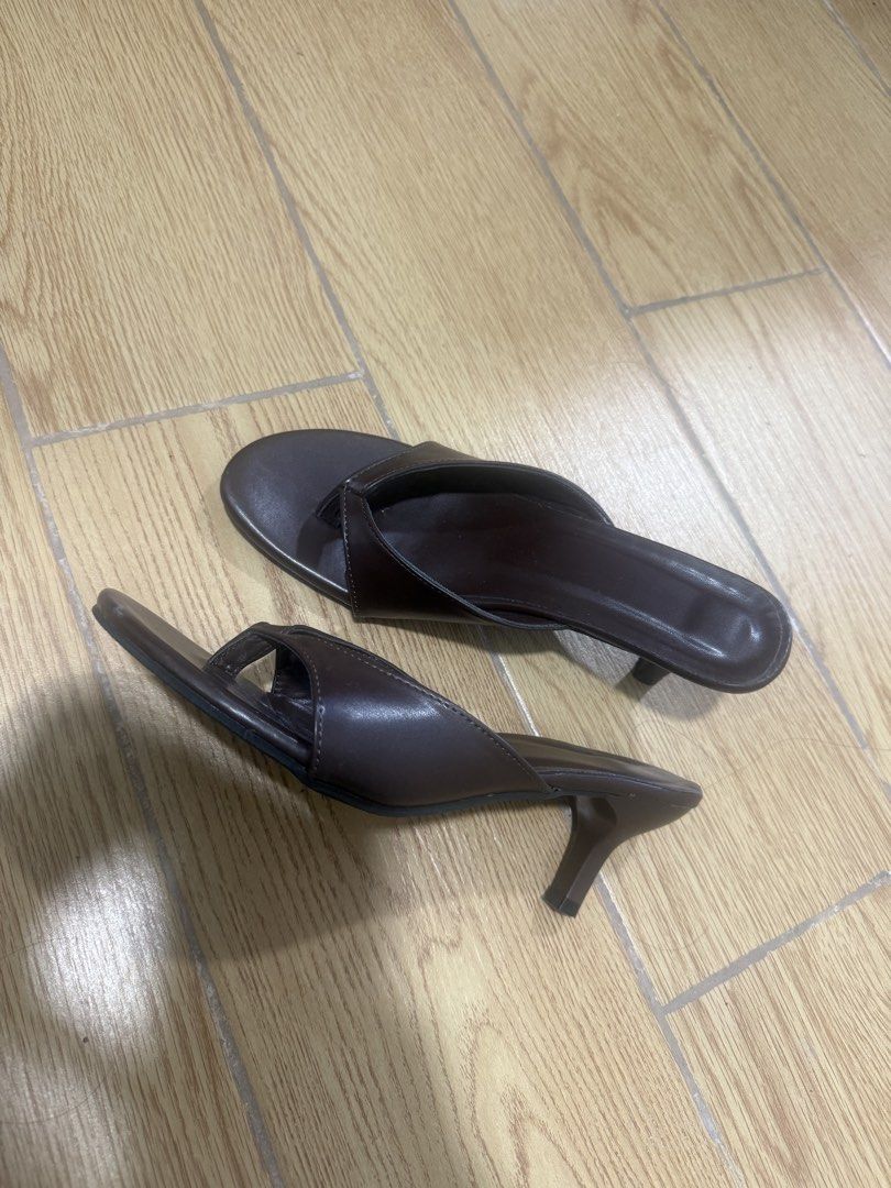 Dark Brown Thong Kitten Heel Mules Size 36 (Category: Heels) located in Manila. Submitted by iya.prlta (Listing ID 1469999603, Image 3). Description: - Color: Dark brown - Style: Thong-style kitten heels, slip-on with open pointed toe - Heel: Low heel for easy walking - Size: 36 (stamped on sole) - Condition: Worn once, minor light dirt on soles from outdoor wear.