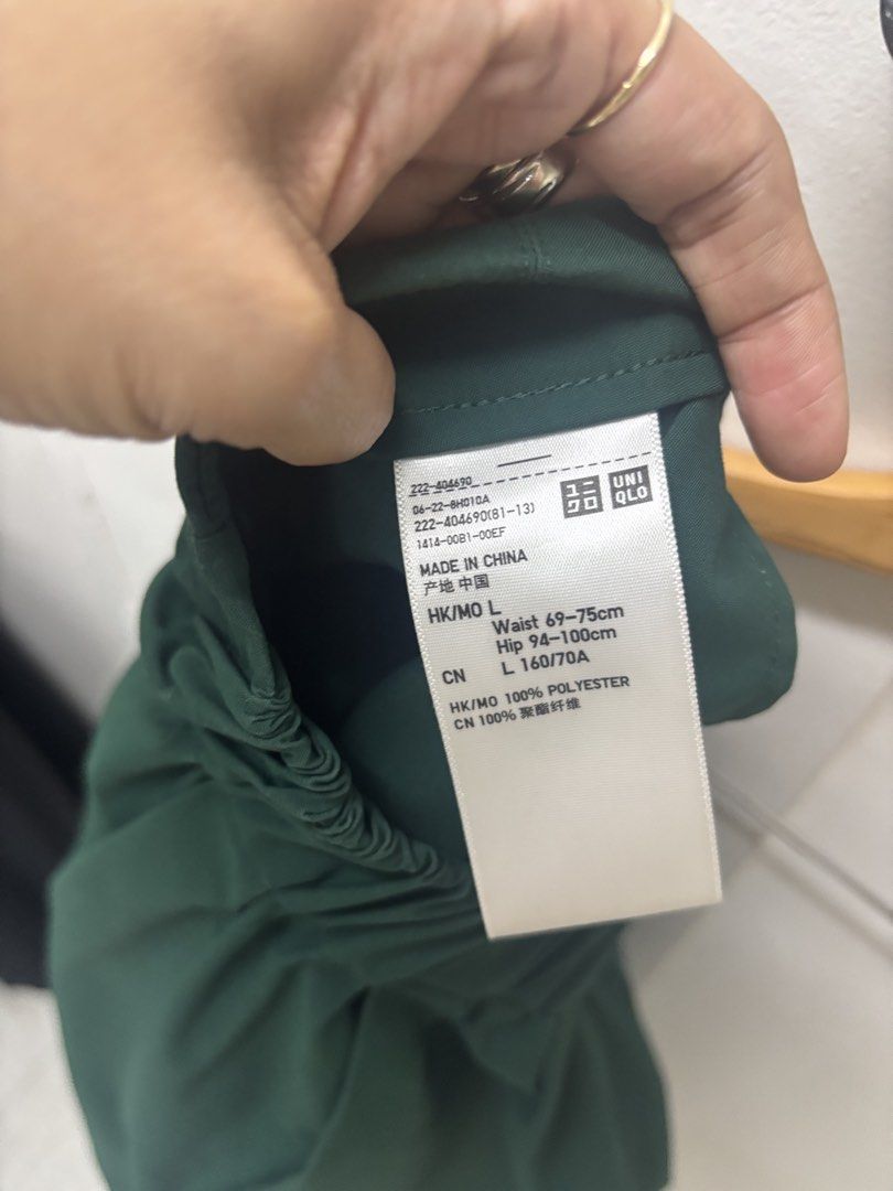 Dark Green Pleated Midi Skirt (Category: Skirts) located in Manila. Submitted by lovenewseason (Listing ID 1470059028, Image 3). Description: - Color: Dark green - Style: Pleated midi skirt with structured pleats - Length: Mid-length (falls just below the knee) - Details: Clean waistband with neat stitching - Versatility: Easy to pair with sweaters, tops, or jackets for casual or smart outfits - Condition: Clean fabric, hangs nicely.