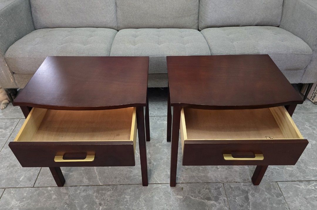 Dark Wood Bedside night table Mahogany (Category: Shelves, Cabinets & Racks) located in San Juan City. Submitted by YardSaleSanJuan (Listing ID 1469983845, Image 2). Description: - Set of 2 dark wood bedside tables - Single pull-out drawer with gold-tone rectangular handles per table - Sturdy wooden legs and stylish curved top edge - Clean interior wood finish - Normal signs of use on the surface - Great matching set for any bedroom setup Mahogan