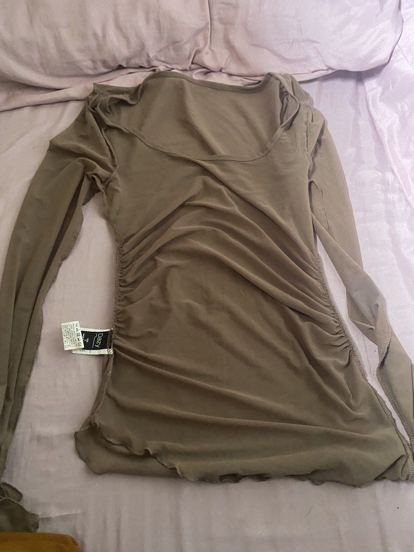 Dazy Brown Mesh Long Sleeve Top (Category: Longsleeves) located in Las Pinas. Submitted by sxo.seya (Listing ID 1469974672, Image 2). Description: - Brand: Dazy - Size: S (tag attached) - Color: Brown - Material: Lightweight, sheer stretch fabric - Design: Scoop neckline, ruched sides, exposed stitching details.