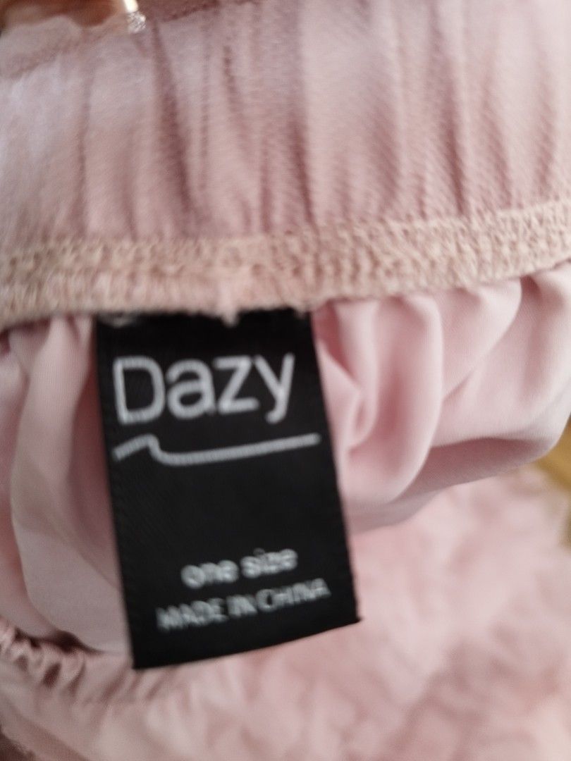 Dazy Pink Tulle Ruffle Midi Skirt One Size (Category: Skirts) located in Cavite. Submitted by RAJATREASUREBOX (Listing ID 1469993621, Image 3). Description: - Brand: Dazy - Style: Pink tulle skirt with all-over layered ruffles - Fit: One size fits most with a comfortable elastic waistband - Material: Light, flowy fabric with a full lining underneath - Versatility: Easy to dress up for events or keep casual for everyday wear.
