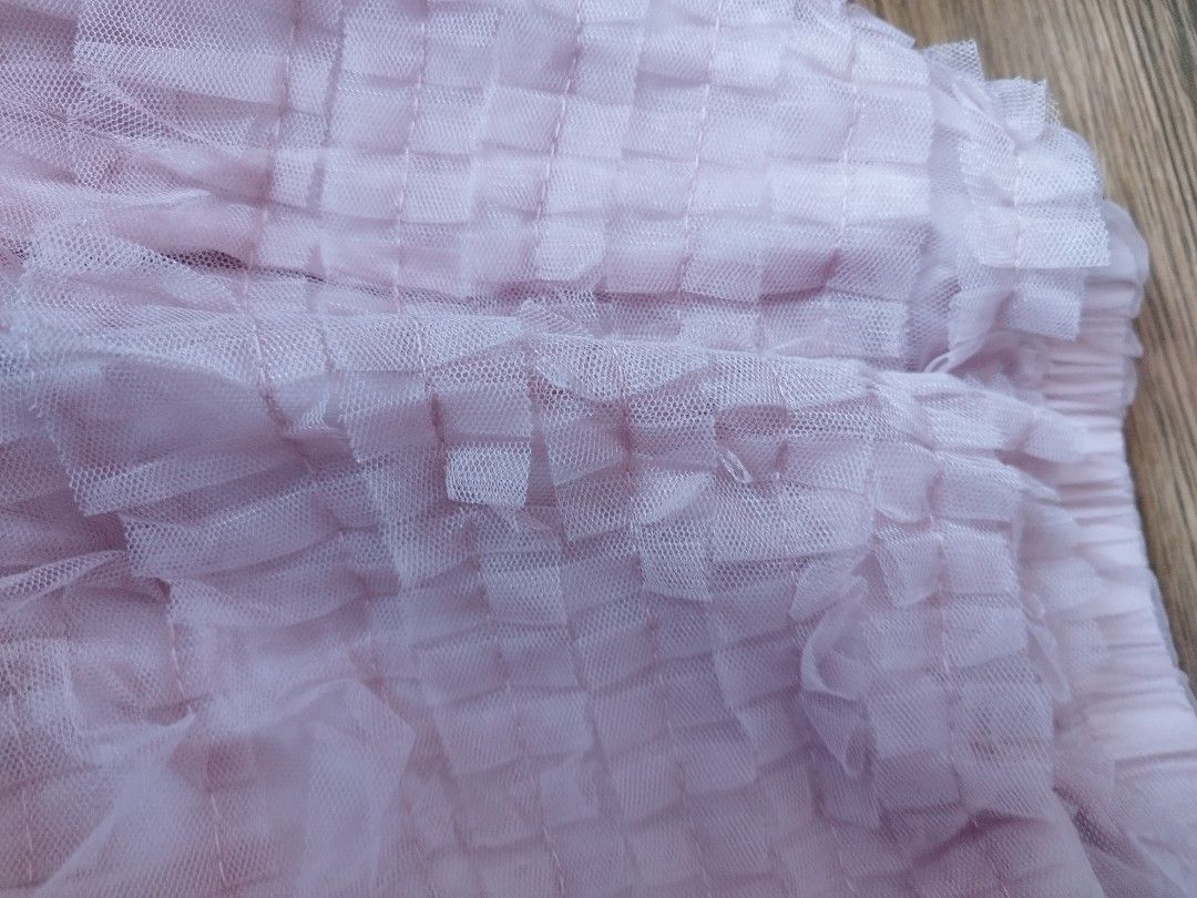 Dazy Pink Tulle Ruffle Midi Skirt One Size (Category: Skirts) located in Cavite. Submitted by RAJATREASUREBOX (Listing ID 1469993621, Image 2). Description: - Brand: Dazy - Style: Pink tulle skirt with all-over layered ruffles - Fit: One size fits most with a comfortable elastic waistband - Material: Light, flowy fabric with a full lining underneath - Versatility: Easy to dress up for events or keep casual for everyday wear.