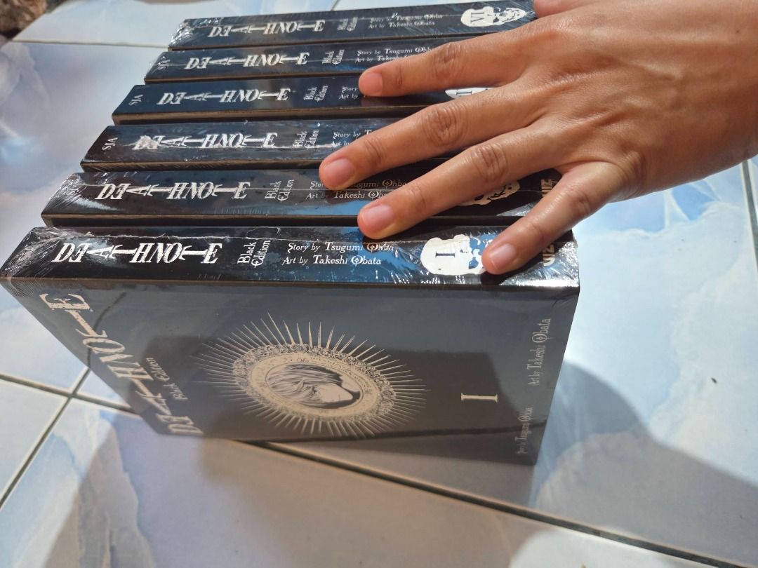 Death Note Black Edition Volumes 1 to 6 Set (Category: Comics & Manga) located in Bacolod City. Submitted by backtrack.vtg (Listing ID 1470088369, Image 2). Description: - Death Note Black Edition Manga Set (Volumes 1-6) - Story by Tsugumi Ohba & Art by Takeshi Obata - Published by VIZ Media - Omnibus format combining multiple volumes per book - Sleek, special black covers - Brand new and still wrapped in plastic packaging.