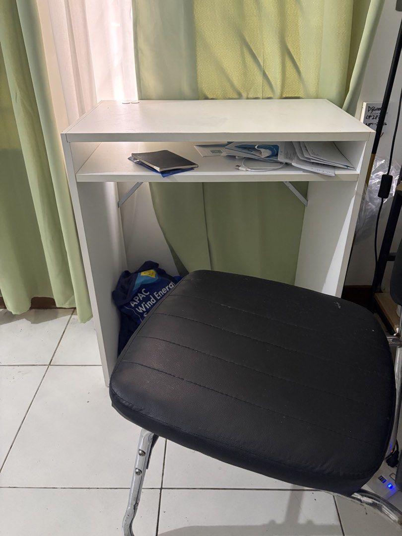 Decluttering: IKEA Study Table (IKEA TORALD DESK) (Category: Tables & Sets) located in Manila. Submitted by herreramar34596 (Listing ID 1470006323, Image 1). Description: - Color & Material: Sturdy white wooden construction - Design: Compact size with straight legs and an open middle shelf for papers and small items - Condition: Minor wear and marks on the surface from regular use; visible screw heads on the side panel Dimensions: 65 x 40 cm (25 