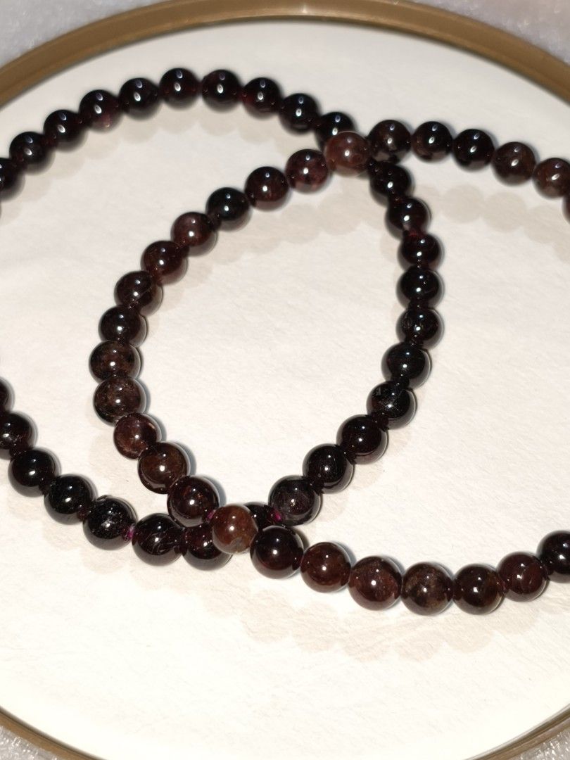 Delicate 5mm Natural Garnet Crystal Beaded Bracelet (Category: Bracelets) located in Caloocan City. Submitted by books_and_beads (Listing ID 1470102483, Image 1). Description: - Material: Deep red garnet gemstone beads with a polished finish -Bead size: 5mm - Color: Deep, rich burgundy/oxblood red that appears almost black in low light, with a subtle translucent wine glow when held up to a light source. · Texture: Smooth, polished beads with slig