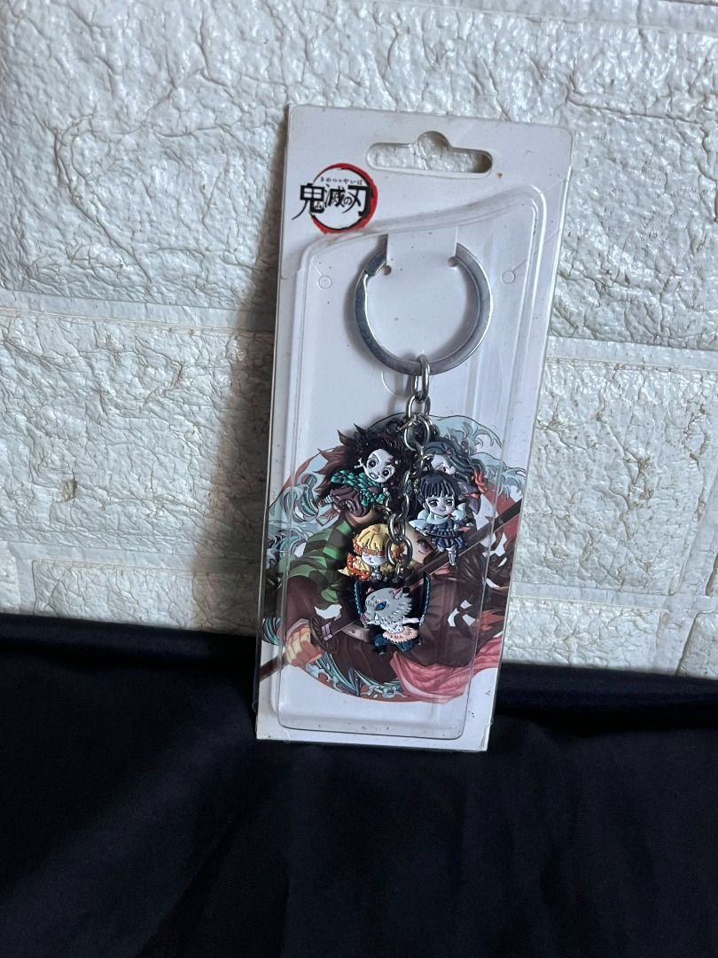 Demon Slayer Keychain (Category: J-Wave Merchandise) located in Quezon City. Submitted by shime_diel (Listing ID 1470121897, Image 1). Description: - Bought in Comic Alley years ago - Has Tanjiro, Inosuke, Zenitsu, and Kanao.