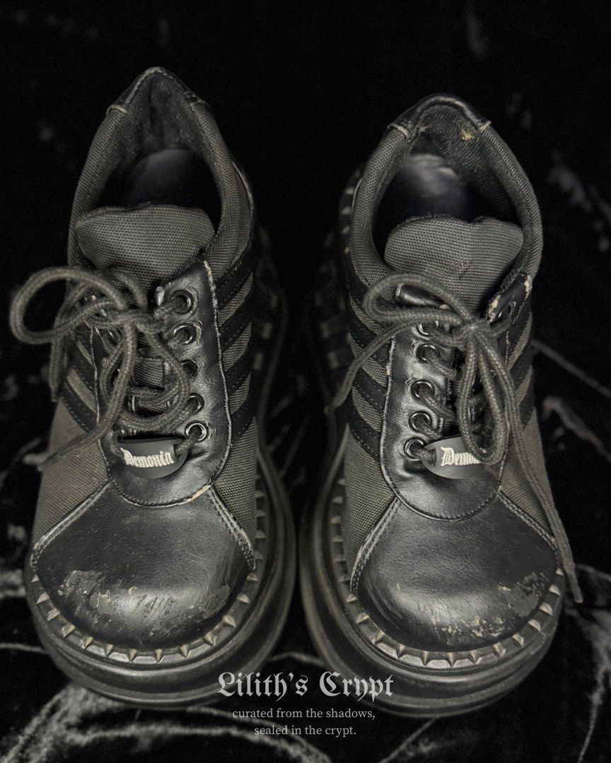 demonia stomp-08 | alt, goth, gothic (Category: Wedges) located in Manila. Submitted by markedbylilith_ (Listing ID 1470045156, Image 1). Description: ┊ ┊ ┊ ✧ size : us 7, eu 37 ✧ insole : 9.5" ✧ height : 4.5" (platform / wedge) ✧ flaw/s : visible peeling/scuffing along the toe caps, edges, and insole as shown 𖤐 iconic chunky platform wedge sneakers with textured ribbed side stripes and metal eyelet lace-up closure 𖤐 signature demonia branded r