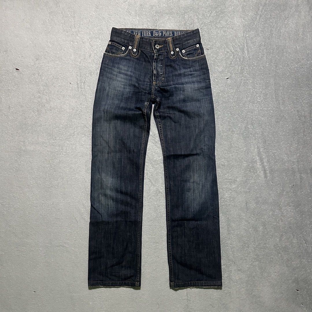 D&G Magic Denim Jeans Size 28 (Category: Jeans) located in Bayombong. Submitted by rochelle_archive_garments (Listing ID 1470040325, Image 1). Description: - Brand/Model: Vintage D&G Magic Denim Jeans - Wash: Dark wash - Size: Tagged Size 28 - Closure: Button fly - Unique Details: Interior waistband printed with global city names, branded leather patch on the back, and distinct stitched detailing on back pockets - Origin: Made in Tunisia - Condit