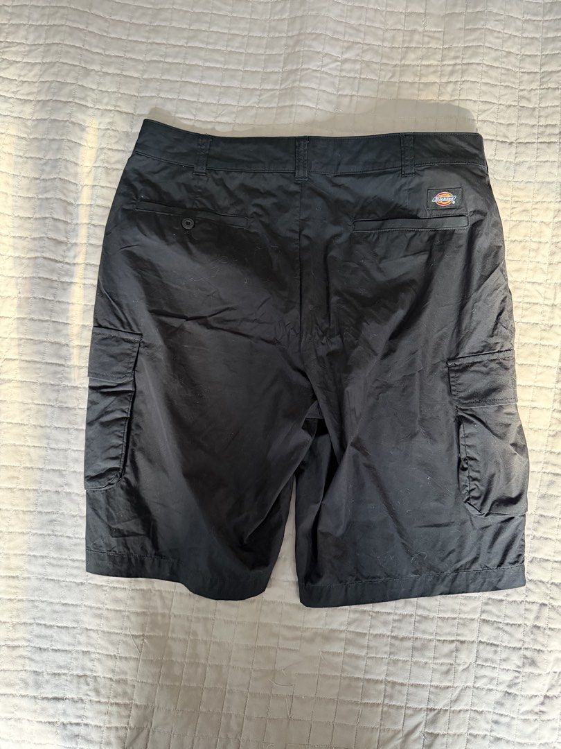 Dickies Black Cargo Shorts (Category: Shorts) located in Quezon City. Submitted by harringtonmnl (Listing ID 1470040758, Image 1). Description: - Brand: Dickies - Color: Classic black - Dimes 32 x 21.5, 10.5” hem - Design: Multiple functional cargo pockets - Closure: Branded button closure - Details: Signature back pocket logo tag - Material: Durable, high-quality fabric construction - Style: Versatile daily wear that matches any outfit.