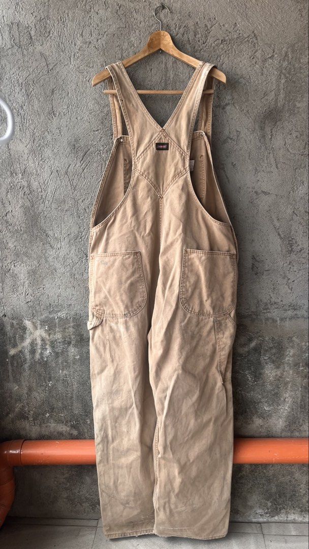Dickies Duck Canvas Overalls Brown 40x30 (Category: Coats, Jackets and Outerwear) located in Cabuyao City. Submitted by bulandos (Listing ID 1470032190, Image 2). Description: - Brand: Dickies - Item: Duck Canvas Overalls - Color: Brown - Size: 40x30 - Material: 100% Cotton, Made in Mexico - Condition: Real workwear patina with authentic stains and wear marks - Features: Heavy-duty utility wear, multiple utility pockets, adjustable shoulder strap
