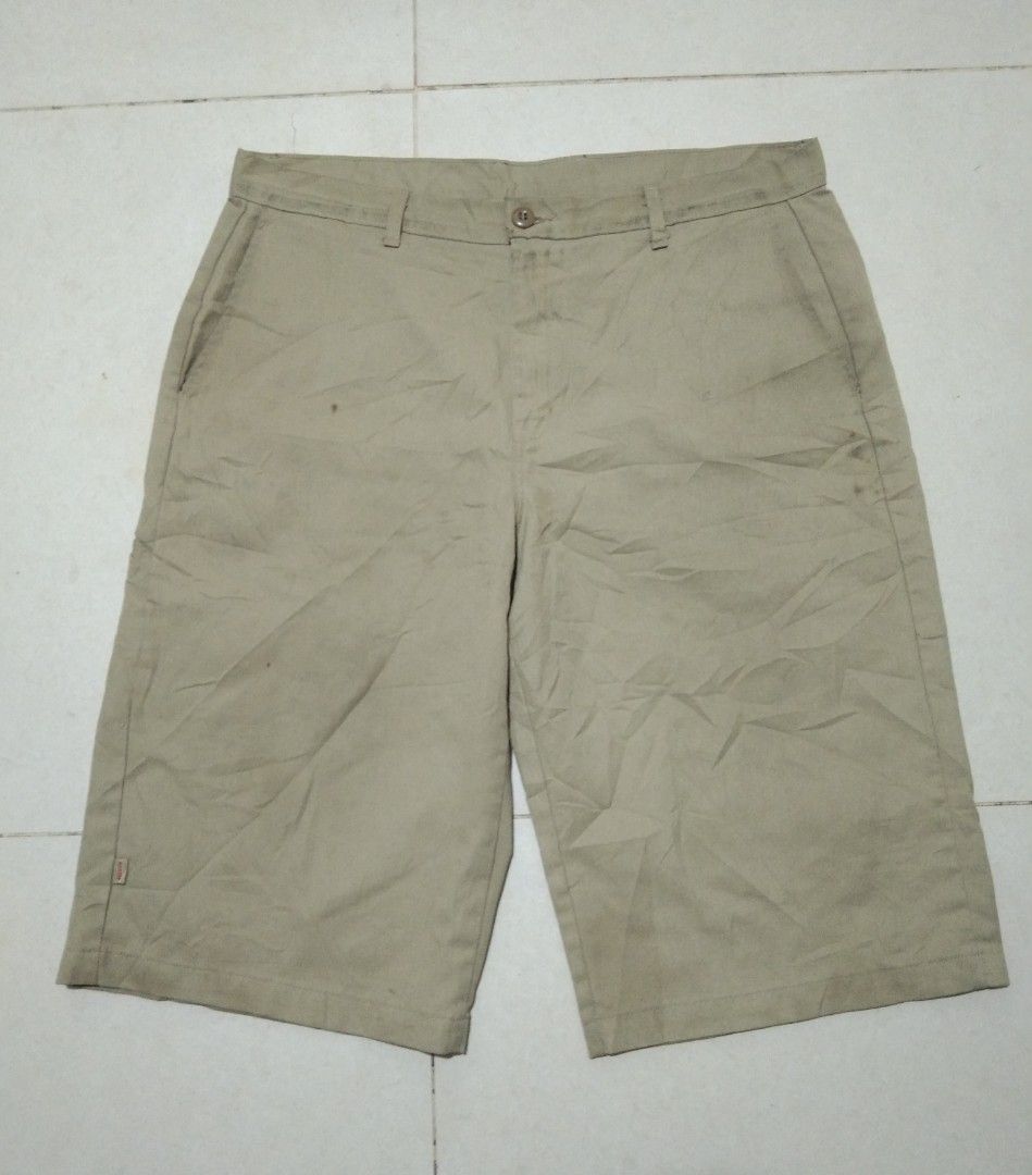 Dickies Men's Beige Cargo Shorts Size 38 (Category: Shorts) located in Manila. Submitted by aj.bermundo (Listing ID 1470061787, Image 1). Description: - Brand: Dickies - Color: Beige - Size: 38 - Material: 65% Polyester, 35% Cotton blend - Fit: Standard fit, knee-length - Features: Button closure, belt loops, practical cargo pockets, signature logo tags on back pocket and lower hem - Origin: Made in Honduras.