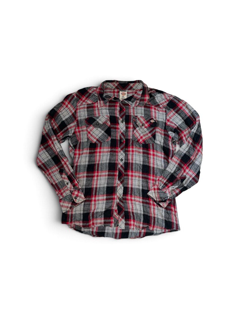 Dickies Red Black Plaid Flannel Shirt (Category: Tshirts & Polo Shirts ) located in Nabua. Submitted by lastthrift2.0 (Listing ID 1469989286, Image 1). Description: Excellent condition - Style: Classic red, black, and white plaid flannel shirt - Size: XL - Material: 100% soft cotton - Features: Dual chest pockets with button closures, button-up front, and button cuffs - Condition: Great for layering in cooler weather.